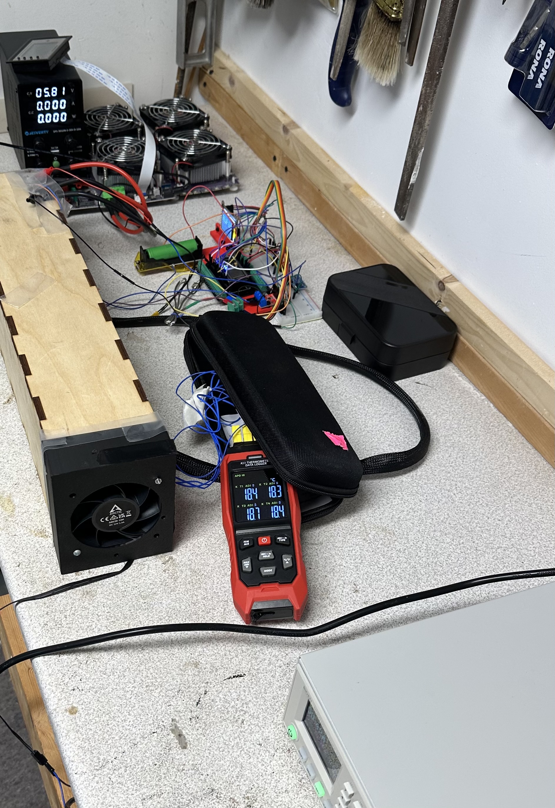 Full battery cooling test setup with Enepaq brick, airflow segment, power supply, and data logging