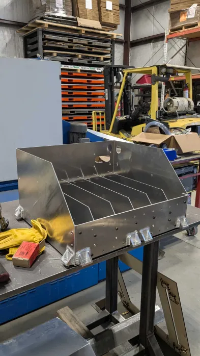 Finished enclosure with tabs welded in place, still on the jig